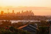 Sydney skyline at golden hour, overlooking the harbour